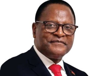 image of smiling Malawi President with eye glasses, red tie with white background.